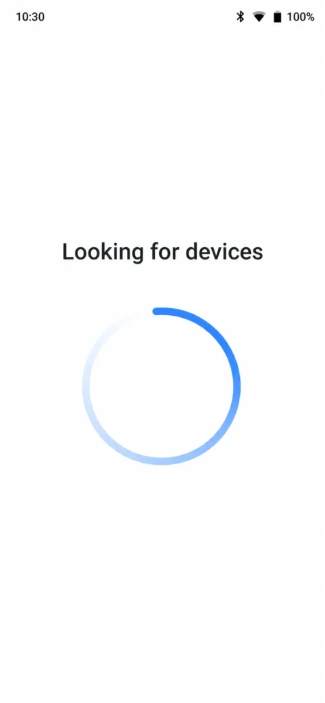Screenshot of Google Home app displaying "Looking for devices" with loading spinner during Bluetooth scanning phase of setup