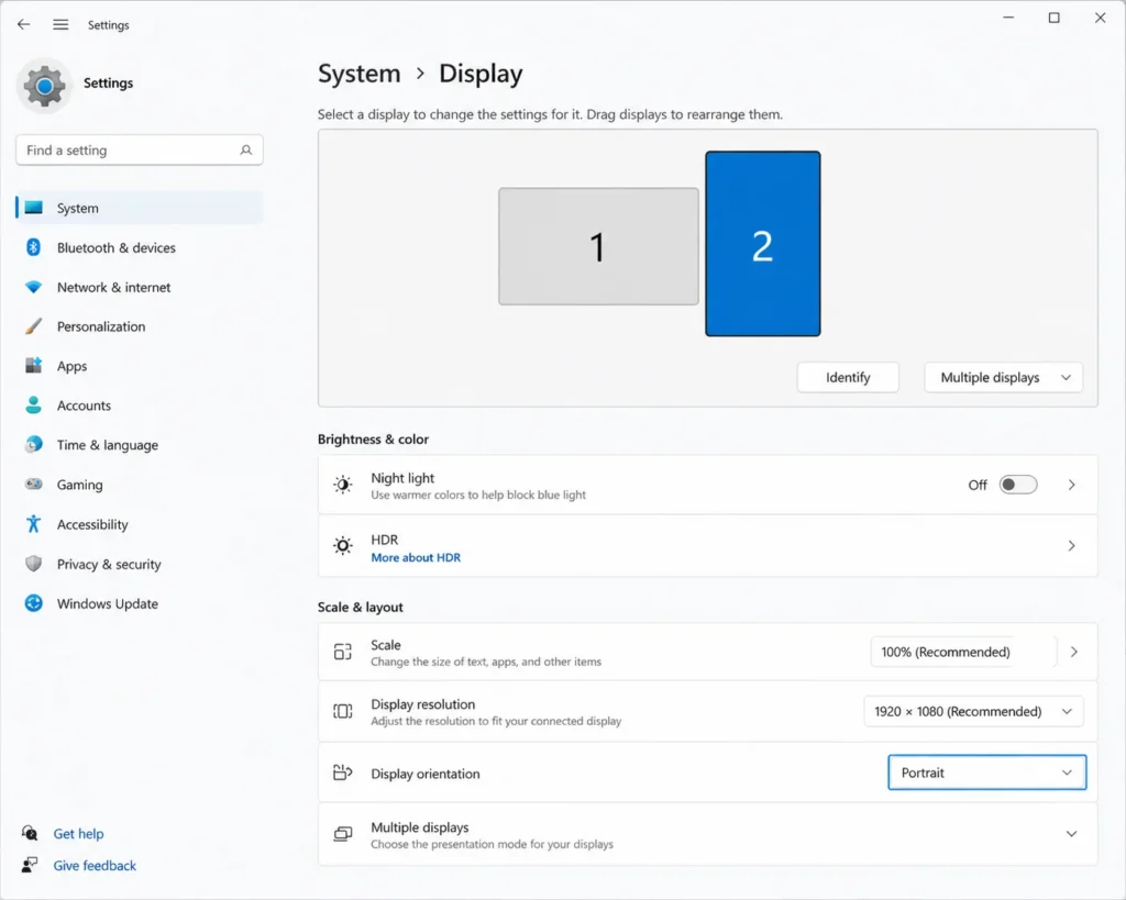 Windows Display Settings showing how to select monitor 2 before changing orientation in dual monitor setup