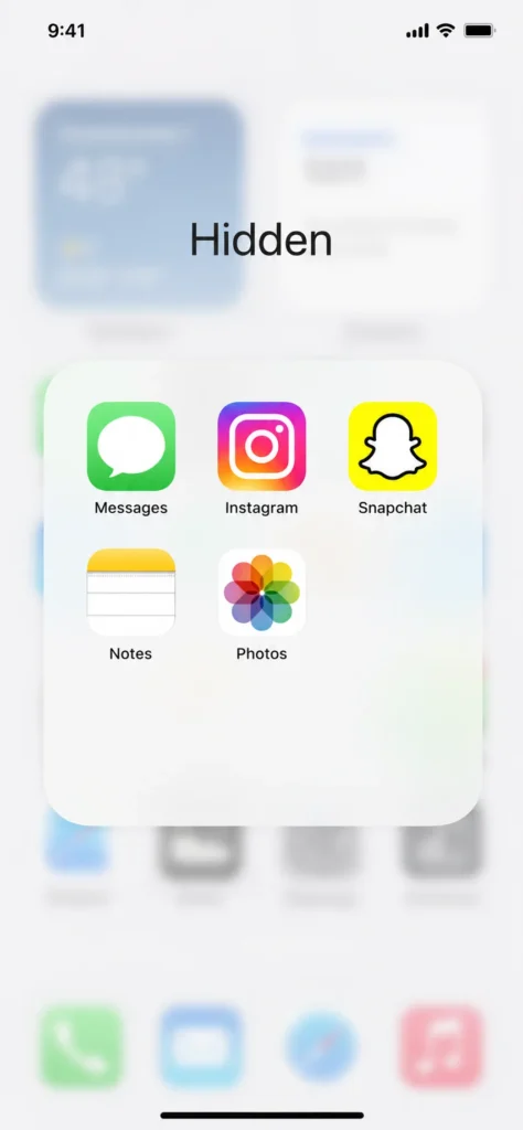 Screenshot of iPhone Hidden folder open after Face ID authentication showing hidden apps stored inside on iOS 18