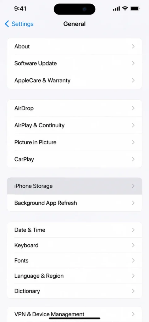 Screenshot showing iPhone Storage option in Settings General menu where hidden apps can be permanently deleted
