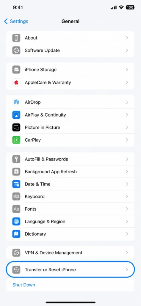 iPhone Settings app showing General menu with Transfer or Reset iPhone option highlighted near the bottom of the list